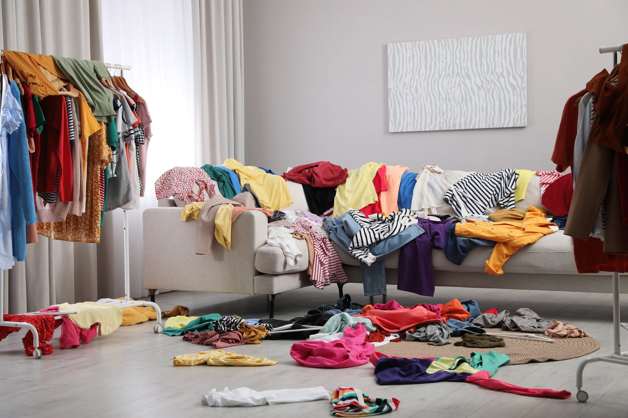 Mess of clothes all over room. Fast fashion